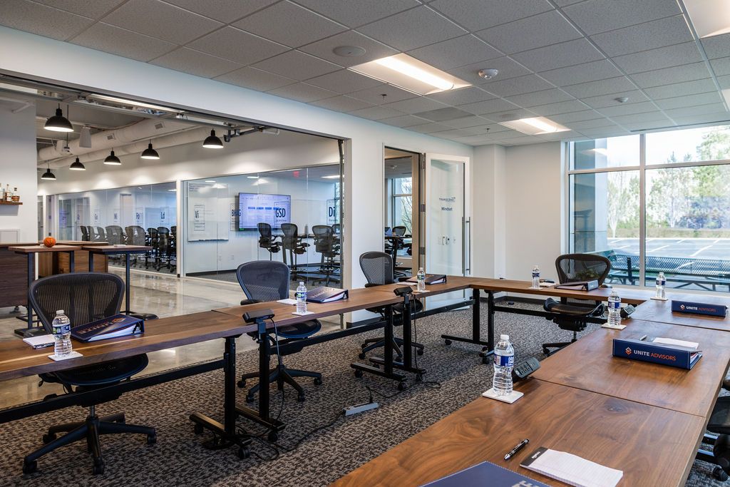 Leaders collaborating on AI readiness assessment in modern conference setting